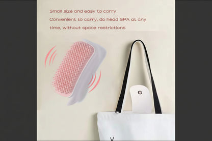 Small device with pink massage pads on a beige background, next to a white tote bag.